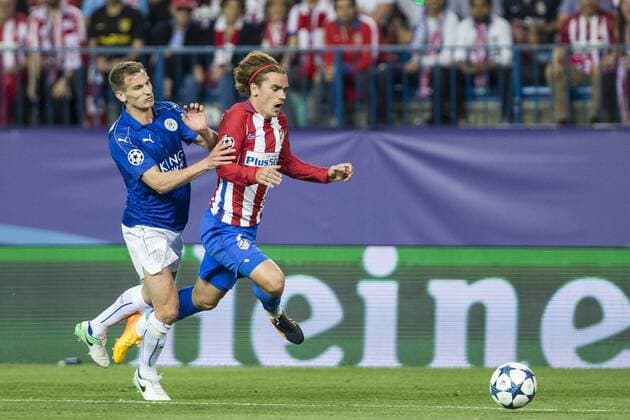 Marc Albringhton of Leicester City Football Club competes for the ball with Antoine Griezmann of Atletico de Madrid during the match of Champions LEague between Atletico de Madrid and LEicester City Football Club at Vicente Calderon Stadium in Madrid, Spain. April 12, 2017.  (20170412017)