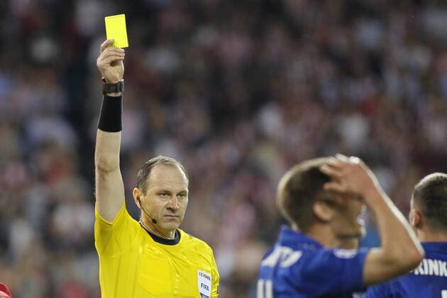 April 12th 2017, Madrid, Spain; UEFA Champions League football quarterfinal, leg 1, Atletico Madrid versus leicester City; Referee Jonas Eriksson from Sweden shows a yellow card to Albringhton for a trip and after a penalty kick for Atletico de Madrid xSantiagoxVidalx  ActionPlus11866778