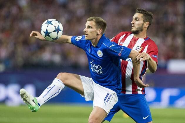 Marc Albringhton of Leicester City Football Club competes for the ball with Koke Resurrecccion of Atletico de Madrid during the match of Champions LEague between Atletico de Madrid and LEicester City Football Club at Vicente Calderon Stadium in Madrid, Spain. April 12, 2017.  (20170412088)