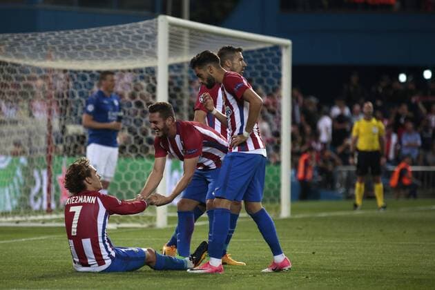 April 12th 2017, Madrid, Spain; UEFA Champions League football quarterfinal, leg 1, Atletico Madrid versus leicester City; Antoine Griezmann on the ground as Koke helps him stand up after the referee signaled a penalty kick for Atletico de Madrid xSantiagoxVidalx  ActionPlus11866934