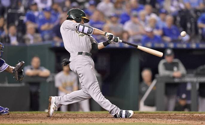 April 12, 2017 - Kansas City, MO, USA - The Oakland Athletics Jed Lowrie connects on a two-run double in the sixth inning against the Kansas City Royals at Kauffman Stadium in Kansas City, Mo., on Wednesday, April 12, 2017. Oakland at Kansas City - ZUMAm67_ 20170412_zaf_m67_034 Copyright: xJohnxSleezerx