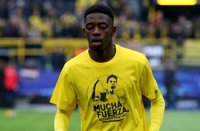 (170413) -- DORTMUND, April 13, 2017 -- Dortmund s Ousmane Dembele is seen in a T-shirt supporting his teammate Marc Bartra, who is injured duirng the attack to the bus of Borussia Dortmund on Tuesday, before the UEFA Champions League quarter-final first leg match between Borussia Dortmund and AS Monaco in Dortmund, Germany, on April 12, 2017. Borussia Dortmund lost 2-3. ) (SP)GERMANY-DORTMUND-SOCCER-UEFA-DORTMUND VS MONACO JoachimxBywaletz 