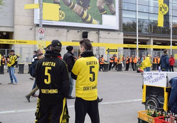 Dortmund loses in CL q final 1st-leg after explosions Supporters of Borussia Dortmund wear a uniform of Spanish defender Marc Bartra at the Bundesliga soccer club s home stadium in Dortmund, Germany, on April 12, 2017, a day after Bartra was injured in an explosion near a bus carrying team members. Dortmund lost to AS Monaco 3-2 in a rescheduled Champions League quarterfinal first-leg match. 