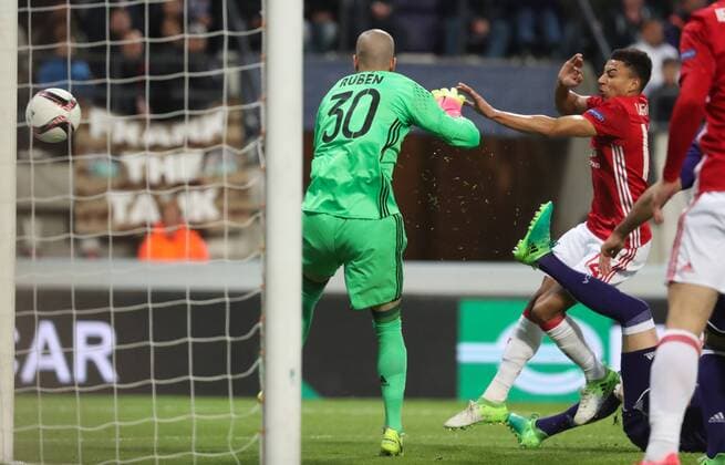 Anderlecht s goalkeeper Ruben Martinez (C) and Manchester s Jesse Lingard (R) pictured in action during a soccer game between Belgian team RSC Anderlecht and English club Manchester United ManU F.C. in Brussels, Thursday 13 April 2017, the first leg of the quarter finals of the Europa League competition. VIRGINIExLEFOUR  x05081107x
