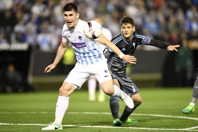 Genk s Ruslan Malinovsky and Celta s Nemanja Radoja fight for the ball during a soccer game between Spanish club Real Club Celta de Vigo and Belgian team KRC Genk, Thursday 13 April 2017, in Vigo, Spain, the first leg of the quarter finals of the Europa League competition. YORICKxJANSENS  x05081123x