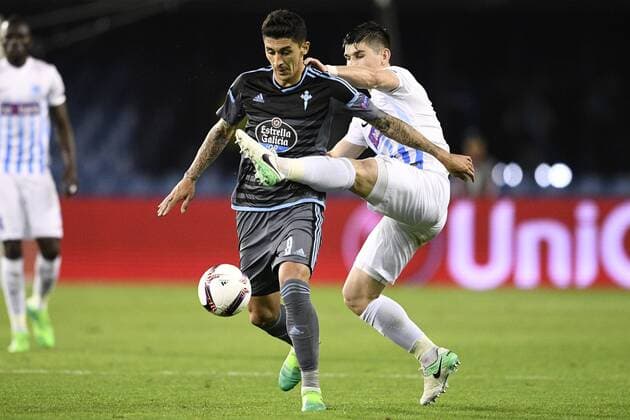 Celta s Pablo Hernandez and Genk s Ruslan Malinovsky fight for the ball during a soccer game between Spanish club Real Club Celta de Vigo and Belgian team KRC Genk, Thursday 13 April 2017, in Vigo, Spain, the first leg of the quarter finals of the Europa League competition. YORICKxJANSENS  x05081271x