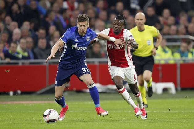 (L-R) Matija Nastasic of FC Schalke 04, Bertrand Traore of Ajaxduring the UEFA Europa League quarter final match between Ajax Amsterdam and FC Schalke 04 at the Amsterdam Arena on April 13, 2017 in Amsterdam, The Netherlands Ajax v FC Schalke 04 UEFA Europa League 2016 2017 xVIxxIVx 7563940