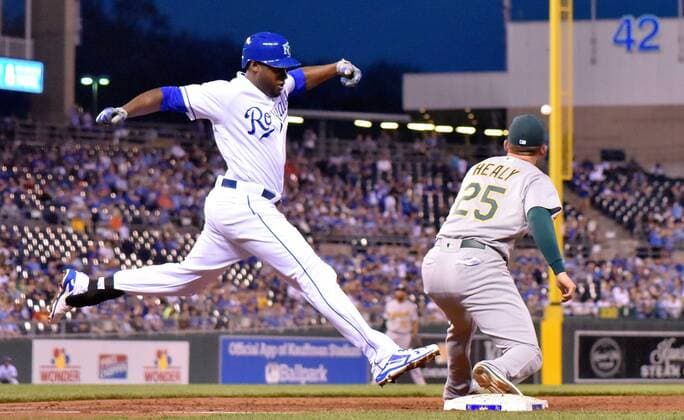 April 13, 2017 - Kansas City, MO, USA - The Kansas City Royals Lorenzo Cain beats the throw to Oakland Athletics first baseman Ryon Healy (25) in the third inning for a single at Kauffman Stadium in Kansas City, Mo., on Thursday, April 13, 2017. Oakland at Kansas City - ZUMAm67_ 20170413_zaf_m67_057 Copyright: xJohnxSleezerx