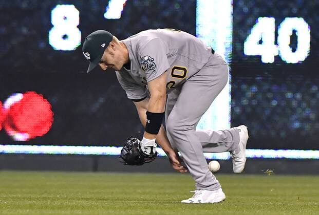 April 13, 2017 - Kansas City, MO, USA - Oakland Athletics right fielder Mark Canha drops a line drive for a single bythe Kansas City Royals Eric Hosmer in the fifth inning at Kauffman Stadium in Kansas City, Mo., on Thursday, April 13, 2017. Oakland at Kansas City - ZUMAm67_ 20170413_zaf_m67_064 Copyright: xJohnxSleezerx