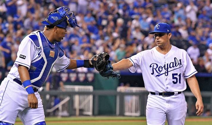 April 13, 2017 - Kansas City, MO, USA - Kansas City Royals starting pitcher Jason Vargas is congratulated by catcher Salvador Perez after Vargas initiated a double play to end the top of the seventh inning against the Oakland Athletics at Kauffman Stadium in Kansas City, Mo., on Thursday, April 13, 2017. Oakland at Kansas City - ZUMAm67_ 20170413_zaf_m67_061 Copyright: xJohnxSleezerx