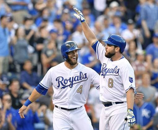 April 14, 2017 - Kansas City, MO, USA - The Kansas City Royals Mike Moustakas (8) is congratulated by teammate Alex Gordon (4) after Moustakas hit a two-run home run in the first inning against the Los Angeles Angels at Kauffman Stadium in Kansas City, Mo., on Friday, April 14, 2017. Anaheim at Kansas City - ZUMAm67_ 20170414_zaf_m67_015 Copyright: xJohnxSleezerx