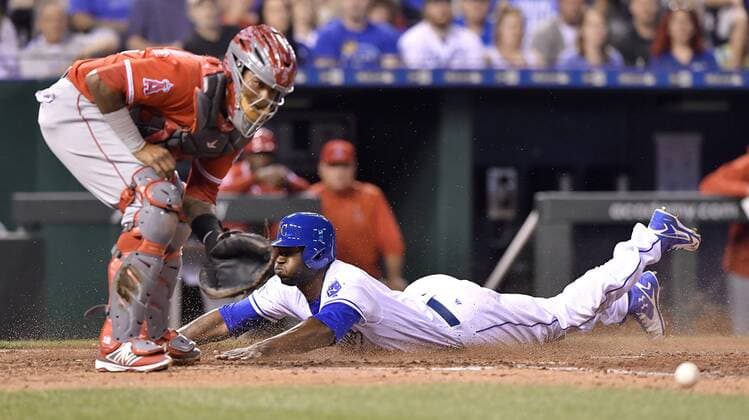 April 14, 2017 - Kansas City, MO, USA - The Kansas City Royals Lorenzo Cain scores behind Los Angeles Angels catcher Martin Maldonado on a sacrifice fly by Salvador Perez in the third inning at Kauffman Stadium in Kansas City, Mo., on Friday, April 14, 2017. Anaheim at Kansas City - ZUMAm67_ 20170414_zaf_m67_021 Copyright: xJohnxSleezerx