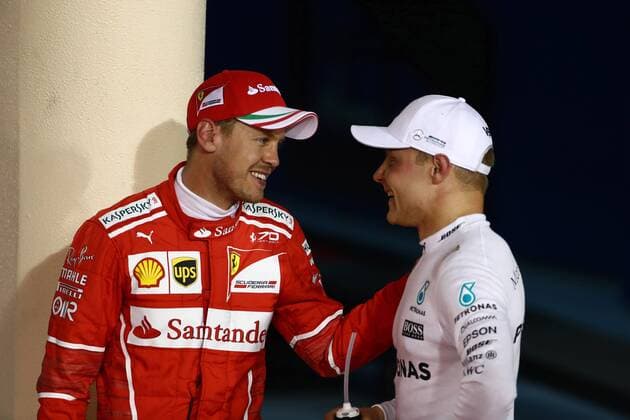 Bahrain Grand Prix, Sakhir 13 - 16 April 2017 15.04.2017 - Qualifying, 3rd place Sebastian Vettel (GER) Scuderia Ferrari SF70H and Valtteri Bottas (FIN) Mercedes AMG F1 W08 pole position 