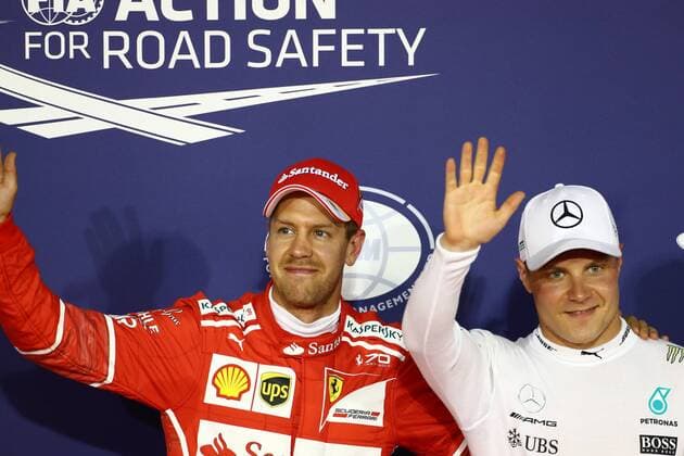 Bahrain Grand Prix, Sakhir 13 - 16 April 2017 15.04.2017 - Qualifying, 3rd place Sebastian Vettel (GER) Scuderia Ferrari SF70H and Valtteri Bottas (FIN) Mercedes AMG F1 W08 pole position 