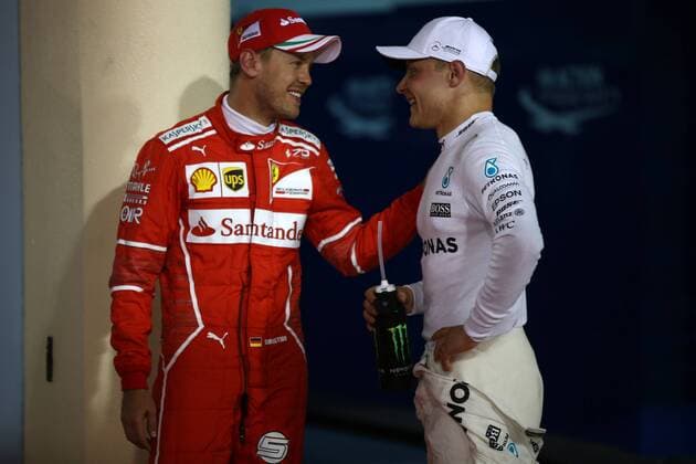 Bahrain Grand Prix, Sakhir 13 - 16 April 2017 15.04.2017 - Qualifying, 3rd place Sebastian Vettel (GER) Scuderia Ferrari SF70H and Valtteri Bottas (FIN) Mercedes AMG F1 W08 pole position 