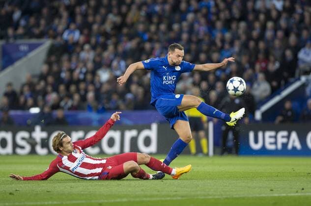 April 18th 2017, Leicester, England, UEFA Champions League football quarter-final, Leicester City versus Atletico Madrid; Danny Drinkwater of Leicester City clears the ball high as Antoine Griezmann of Atletico Madrid tackles him xRolandxHarrisonx  ActionPlus11869625