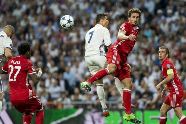 Cristiano Ronaldo of Real Madrid competes for the ball with Mats Hummels of FC Bayern Munchen during the match of Champions League between Real Madrid and FC Bayern Munchen at Santiago Bernabeu Stadium in Madrid, Spain. April 18, 2017.  (20170418036)