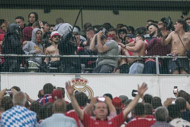 Supporters of FC Bayern Munchen and Spanish police created disturbs during the match of Champions League between Real Madrid and FC Bayern Munchen at Santiago Bernabeu Stadium in Madrid, Spain. April 18, 2017.  (20170418054)