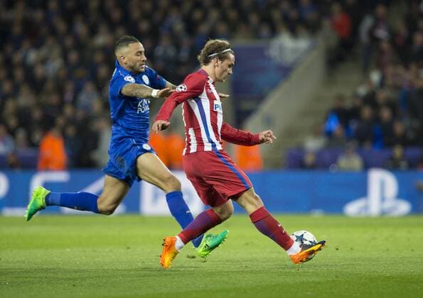 April 18th 2017, Leicester, England, UEFA Champions League football quarter-final, Leicester City versus Atletico Madrid; Antoine Griezmann of Atletico Madrid crossing the ball as Danny Simpson of Leicester City comes in to tackle xRolandxHarrisonx  ActionPlus11869627