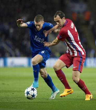 April 18th 2017, Leicester, England, UEFA Champions League football quarter-final, Leicester City versus Atletico Madrid; Jamie Vardy of Leicester City pushed away by Diego Roberto Godin Leal of Atletico Madrid so he can take possession of the ball xRolandxHarrisonx  ActionPlus11869686