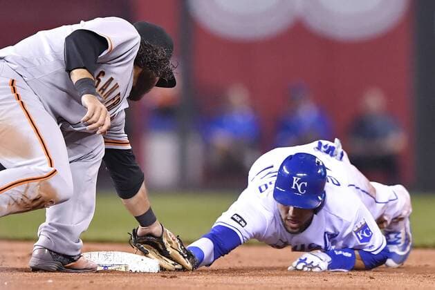April 19, 2017 - Kansas City, MO, USA - The Kansas City Royals Paulo Orlando, right, is tagged out by San Francisco Giants shortstop Brandon Crawford trying to steal second and sliding past the bag in the seventh inning at Kauffman Stadium in Kansas City, Mo., on Wednesday, April 19, 2017. The Royals won, 2-0. San Francisco at Kansas City - ZUMAm67_ 20170419_zaf_m67_043 Copyright: xJohnxSleezerx