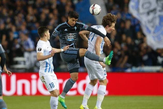Genk s Ruslan Malinovsky and Genk s Sander Berge fight for the ball during the return leg of quarterfinals in the Europa League competition between Belgian soccer team RC Genk and Spanish team Celta Vigo, Thursday 20 April 2017, in Genk. First leg ended on a 2-3 result in Spain. BRUNOxFAHY  x05084066x