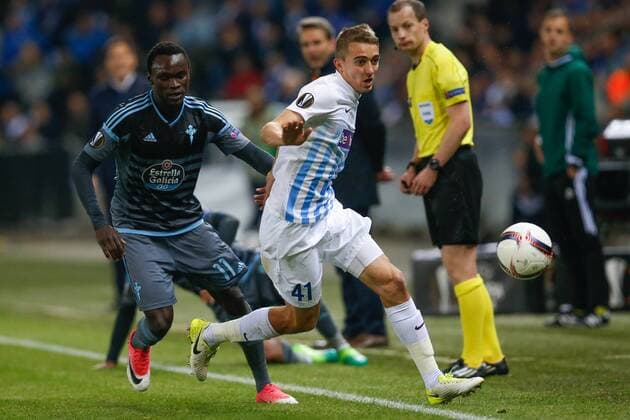Celta s Pione Sisto and Genk s Timothy Castagne fight for the ball during the return leg of quarterfinals in the Europa League competition between Belgian soccer team RC Genk and Spanish team Celta Vigo, Thursday 20 April 2017, in Genk. First leg ended on a 2-3 result in Spain. BRUNOxFAHY  x05084141x