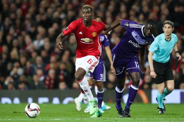 Manchester s Paul Pogba and Anderlecht s Dennis Appiah fight for the ball during the return leg game of the quarterfinals of the Europa League competition between UK team Manchester United ManU and Belgian soccer team RSC Anderlecht in Manchester, UK, Thursday 20 April 2017. First leg ended on a draw result 1-1 in Belgium. VIRGINIExLEFOUR  x05084149x