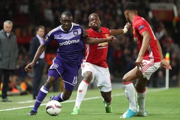 Anderlecht s Dennis Appiah and Manchester s Paul Pogba fight for the ball during the return leg game of the quarterfinals of the Europa League competition between UK team Manchester United ManU and Belgian soccer team RSC Anderlecht in Manchester, UK, Thursday 20 April 2017. First leg ended on a draw result 1-1 in Belgium. VIRGINIExLEFOUR  x05084177x