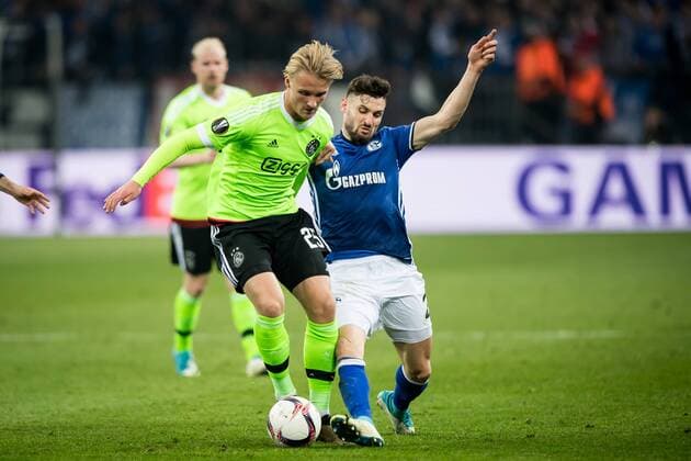 (L-R) Kasper Dolberg of Ajax, Daniel Caligiuri of FC Schalke 04during the UEFA Europa League quarter final match between Schalke 04 and Ajax Amsterdam on April 20, 2017 at the Veltins-Arena in Gelsenkirchen, Germany. Schalke 04 v Ajax UEFA Europa League 2016 2017 xVIxRonaldxBonestrooxfotografiexIVx 7615779