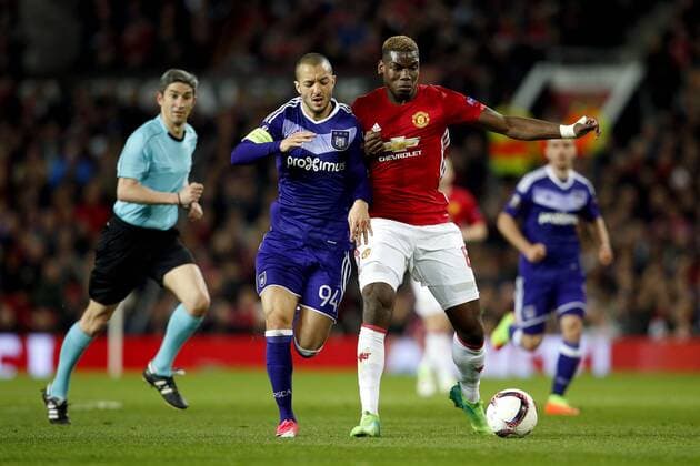 Paul Pogba of Manchester United ManU battles with Sofiane Hanni of Anderlecht during the UEFA Europa League Quarter Final 2nd Leg match at Old Trafford, Manchester. Picture date: April 20th, 2017. Pic credit should read: Matt McNulty Sportimage EDITORIAL USE ONLY. No use with unauthorised audio, video, data, fixture lists, club league logos or live services. Online in-match use limited to 120 images, no video emulation. No use in betting, games or single club league player publications.