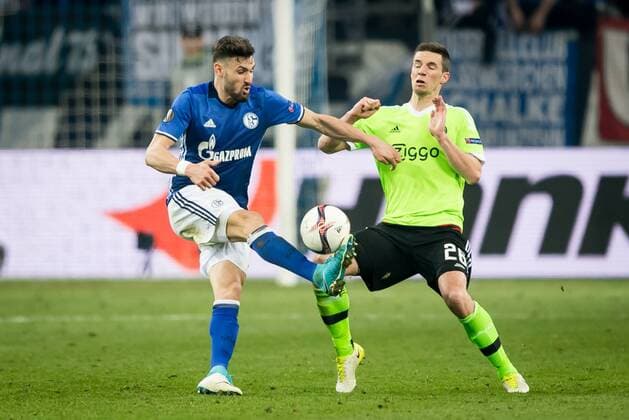 (L-R) Daniel Caligiuri of FC Schalke 04, Nick Viergever of Ajaxduring the UEFA Europa League quarter final match between Schalke 04 and Ajax Amsterdam on April 20, 2017 at the Veltins-Arena in Gelsenkirchen, Germany. Schalke 04 v Ajax UEFA Europa League 2016 2017 xVIxRonaldxBonestrooxfotografiexIVx 7615820