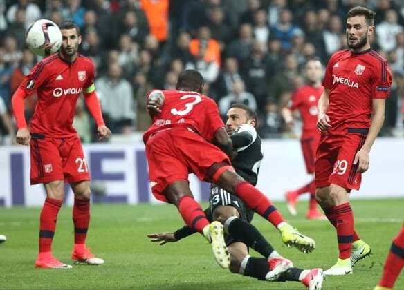 Besiktas player Cenk Tosun and Lyon Players Nicolas Nkoulou , Lucas Tousart 29 during the Europa league Quarter final second match between Besiktas and Lyon at the Vodafone Arena in Istanbul , Turkey April 20, 2017. 