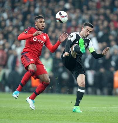 Besiktas player Oguzhan Ozyakup and Lyon Player Corentin Tolisco 8 during the Europa league Quarter final second match between Besiktas and Lyon at the Vodafone Arena in Istanbul , Turkey April 20, 2017. 