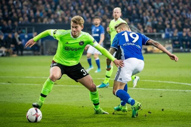(L-R) Matthijs de Ligt of Ajax, Guido Burgstaller of FC Schalke 04during the UEFA Europa League quarter final match between Schalke 04 and Ajax Amsterdam on April 20, 2017 at the Veltins-Arena in Gelsenkirchen, Germany. Schalke 04 v Ajax UEFA Europa League 2016 2017 xVIxRonaldxBonestrooxfotografiexIVx 7617677