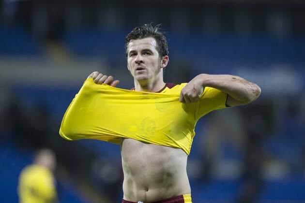 Joey Barton of Burnley takes off his shirt to give it to a fan at the end of the Sky Bet Championship match between Cardiff City and Burnley at the Cardiff City Stadium, Cardiff, Wales on 28 November 2015. Copyright: xMarkxHawkinsx 07040057