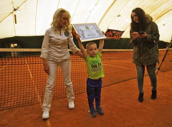 April 21, 2017 - Odessa, Ukraine - Dmytro Kuzminov ( 3 year,9 month old) from Odessa, shows a certificate about his registration as the youngest tennis player in Ukraine, in Kiev, Ukraine, 21 April, 2017. Representatives of National Register of Records registered Dmytro Kuzminov as the youngest tennis player in Ukraine. 3-year old boy is registered as the youngest tennis player in Ukraine  - ZUMAn230 20170421_zaa_n230_022 Copyright: xStrx