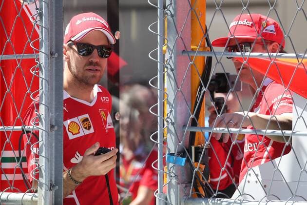 SOCHI, RUSSIA - APRIL 27, 2017: Scuderia Ferrari F1 team drivers Kimi Raikkonen (R) of Finland and Sebastian Vettel of Germany seen ahead of a free practice session of the 2017 Formula One Russian Grand Prix at the Sochi Autodrom racing circuit. Vyacheslav Prokofyev TASS  TS049CD9