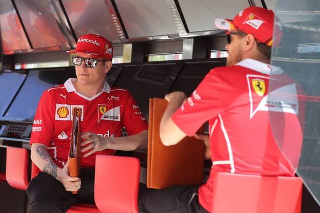 SOCHI, RUSSIA - APRIL 27, 2017: Scuderia Ferrari F1 team drivers Kimi Raikkonen (L) of Finland and Sebastian Vettel of Germany seen ahead of a free practice session of the 2017 Formula One Russian Grand Prix at the Sochi Autodrom racing circuit. Vyacheslav Prokofyev TASS  TS049CDA