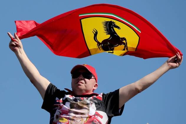 SOCHI, RUSSIA - APRIL 28, 2017: A fan raising a Scuderia Ferrari team flag during a practice session ahead of the 2017 Formula One Russian Grand Prix at the Sochi Autodrom racing circuit. Alexander Demianchuk TASS  TS04A056