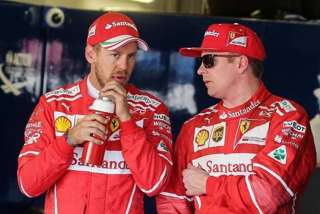 SOCHI, RUSSIA - APRIL 29, 2017: Scuderia Ferrari F1 drivers Sebastian Vettel (L) of Germany and Kimi Raikkonen of Finland talking after a qualifying session for the 2017 Formula One Russian Grand Prix at the Sochi Autodrom racing circuit. Vyacheslav Prokofyev TASS  TS04A279