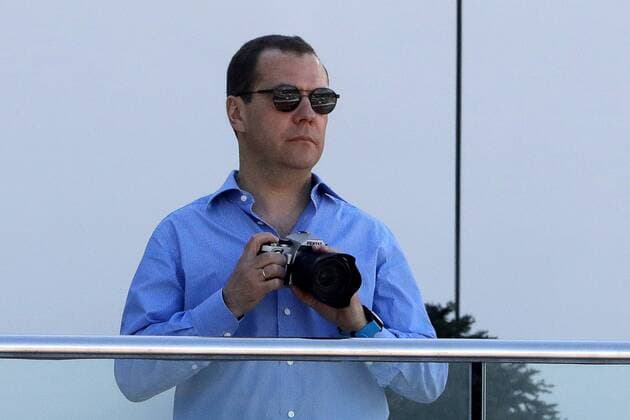SOCHI, RUSSIA - APRIL 30, 2017: Russia s Prime Minister Dmitry Medvedev watches the 2017 Formula One Russian Grand Prix at the Sochi Autodrom racing circuit. Mikhail Metzel TASS  TS04A385