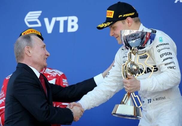 SOCHI, RUSSIA - APRIL 30, 2017: Russia s President Vladimir Putin (L) gives the trophy to the winner, Mercedes AMG Petronas F1 driver Valtteri Bottas of Finland at an awards ceremony for the 2017 Formula One Russian Grand Prix at the Sochi Autodrom racing circuit. Alexander Demianchuk TASS  TS04A39B