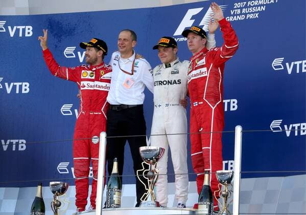 SOCHI, RUSSIA - APRIL 30, 2017: Second-placed Scuderia Ferrari F1 driver Sebastian Vettel of Germany, Mercedes Race Engineer Tony Ross, first-placed Mercedes AMG Petronas F1 driver Valtteri Bottas of Finland, and third-placed Scuderia Ferrari F1 Team driver Kimi Raikkonen of Finland (L-R) at an awards ceremony for the 2017 Formula One Russian Grand Prix at the Sochi Autodrom racing circuit. Alexander Demianchuk TASS  TS04A39D