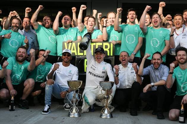 SOCHI, RUSSIA - APRIL 30, 2017: Mercedes AMG Petronas F1 drivers Lewis Hamilton of the United Kingdom, Valtteri Bottas of Finland, Mercedes Race Engineer Tony Ross (L-R in the middle), and other Mercedes Team members pose for a group photo after the 2017 Formula One Russian Grand Prix at the Sochi Autodrom racing circuit. Vyacheslav Prokofyev TASS  TS04A3E5