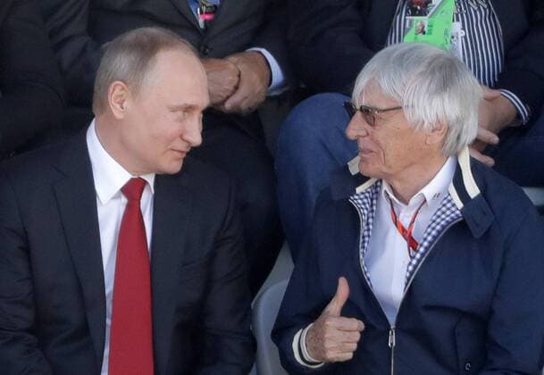 SOCHI, RUSSIA - APRIL 30, 2017: Russia s President Vladimir Putin (L) and Formula One Group Chairman Emeritus Bernard Charles Bernie Ecclestone watch the 2017 Formula One Russian Grand Prix at the Sochi Autodrom racing circuit. Mikhail Metzel TASS  TS04A3ED