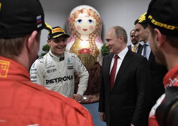 SOCHI, RUSSIA - APRIL 30, 2017: Frst-placed Mercedes AMG Petronas F1 driver Valtteri Bottas of Finland and Russia s President Vladimir Putin (L-R middle) seen after the podium ceremony during the 2017 Formula One Russian Grand Prix at the Sochi Autodrom racing circuit. Alexei Nikolsky Russian Presidential Press and Information Office TASS  TS04A423
