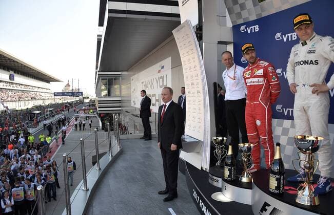 SOCHI, RUSSIA - APRIL 30, 2017: Russia s President Vladimir Putin, Mercedes AMG F1 Race Engineer Tony Ross, second-placed Scuderia Ferrari F1 driver Sebastian Vettel of Germany and first-placed Mercedes AMG Petronas F1 driver Valtteri Bottas (L-R) of Finland during the podium ceremony after the 2017 Formula One Russian Grand Prix at the Sochi Autodrom racing circuit. Alexei Nikolsky Russian Presidential Press and Information Office TASS  TS04A424