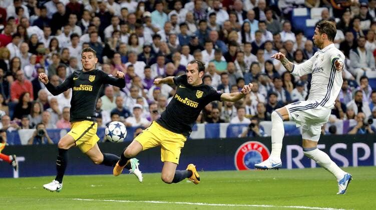 Real Madrid s defender Sergio Ramos (R) vies for the ball with Atletico de Madrid s Uruguayan Diego Godin (C) and Lucas Hernandez during the UEFA Champions League semifinal match between Real Madrid and Atletico de Madrid at the Santiago Bernabeu stadium in Madrid, Spain, 02 May 2017. REAL MADRID VS. ATLETICO DE MADRID !ACHTUNG: NUR REDAKTIONELLE NUTZUNG!  Copyright: xJuanJoxMartinx MAD001 20170502-636293574388850889