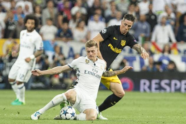 Toni Kroos of Real Madrid holds off pressure from Fernando Torres of Atletico de Madrid during the match of Champions League between Real Madrid and Atletico de Madrid at Santiago Bernabeu Stadium in Madrid, Spain. May 02, 2017.  (20170502100)